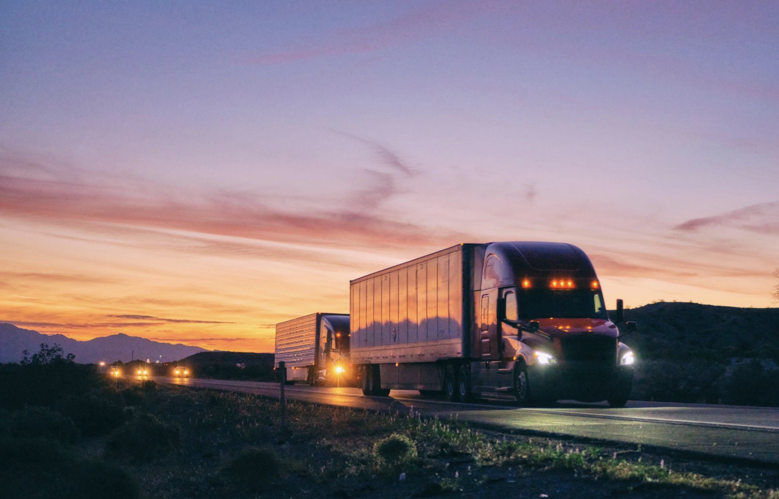 Truck on highway at sunrise